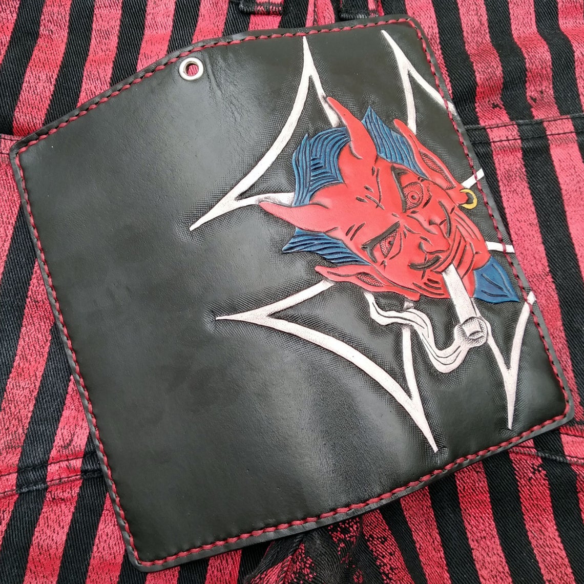 Biker-style wallet with engraved devil and flags by Another Way of Life
